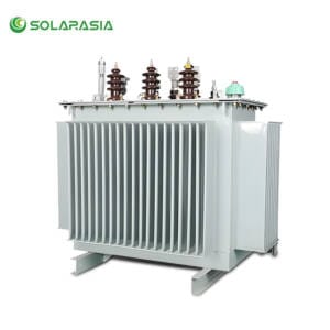 33kV oil-immersed power transformer unit, showing radiator fins and HV/LV bushings, installed in a substation for high-voltage power distribution.