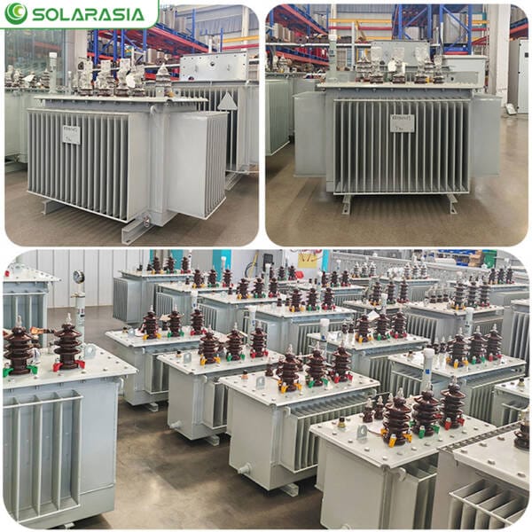 Inside view of a modern transformer factory production floor or showroom, showcasing multiple oil immersed transformers in various stages of assembly or ready for shipment.