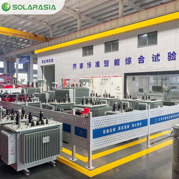 Engineers or technicians conducting final checks or testing on a 2000kVA oil immersed transformer within the modern Solarasia factory