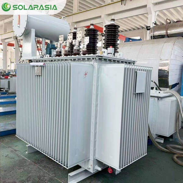 A finished 1.5MVA oil immersed power transformer positioned in the factory warehouse, crated and prepared for secure shipping to a customer.