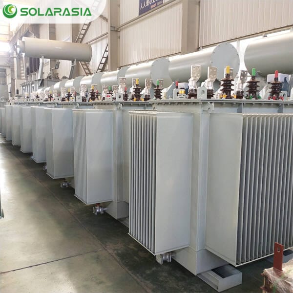 Wide-angle shot of our transformer production factory showing multiple 1.5MVA oil filled transformers in various stages of assembly and preparation for shipment.