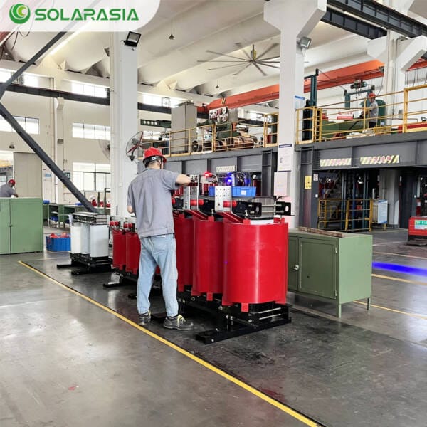 Technician performing quality checks on a 500KVA Dry Type Transformer.