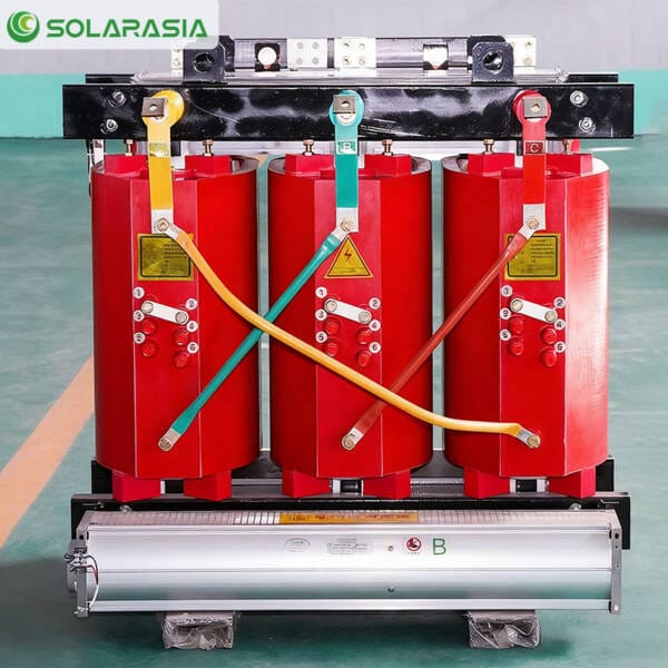 Front view of a 1250KVA Dry Type Transformer on the production floor, showcasing its terminal arrangement and sturdy build quality.