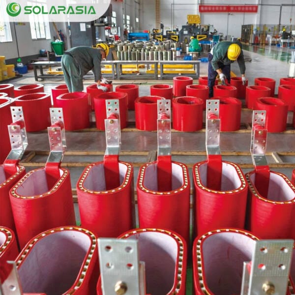 Close-up detail of the vibrant red resin insulation coating on the windings of our 650KVA Dry Type Transformer.