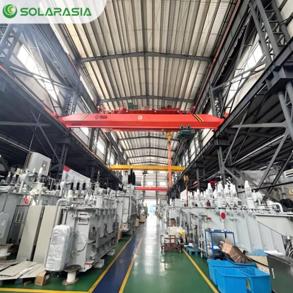 Multiple 400KVA oil immersed transformers ready for shipment in a factory warehouse.