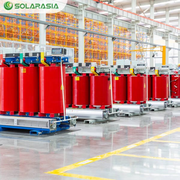 Wide-angle side view of a 50KVA Dry Type Transformer on the factory production floor, highlighting its solid structure and quality craftsmanship.