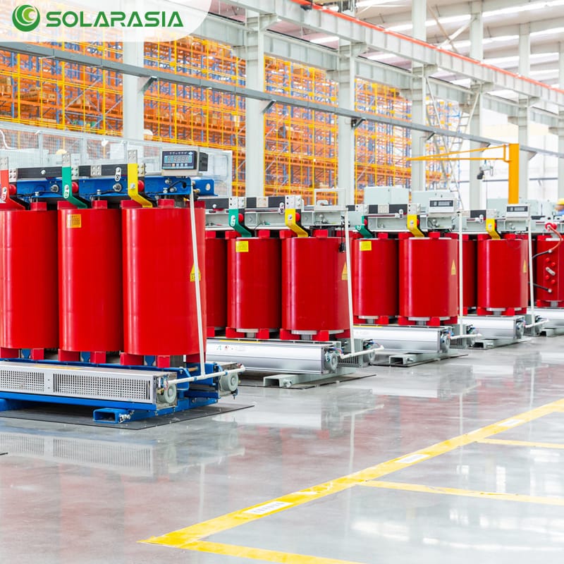 Wide-angle side view of a 50KVA Dry Type Transformer on the factory production floor, highlighting its solid structure and quality craftsmanship.