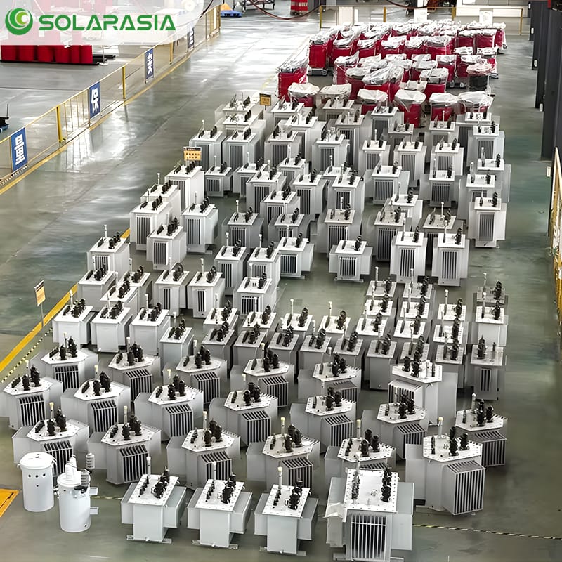 Wide-angle shot of a 200KVA oil immersed transformer installed in a factory environment.