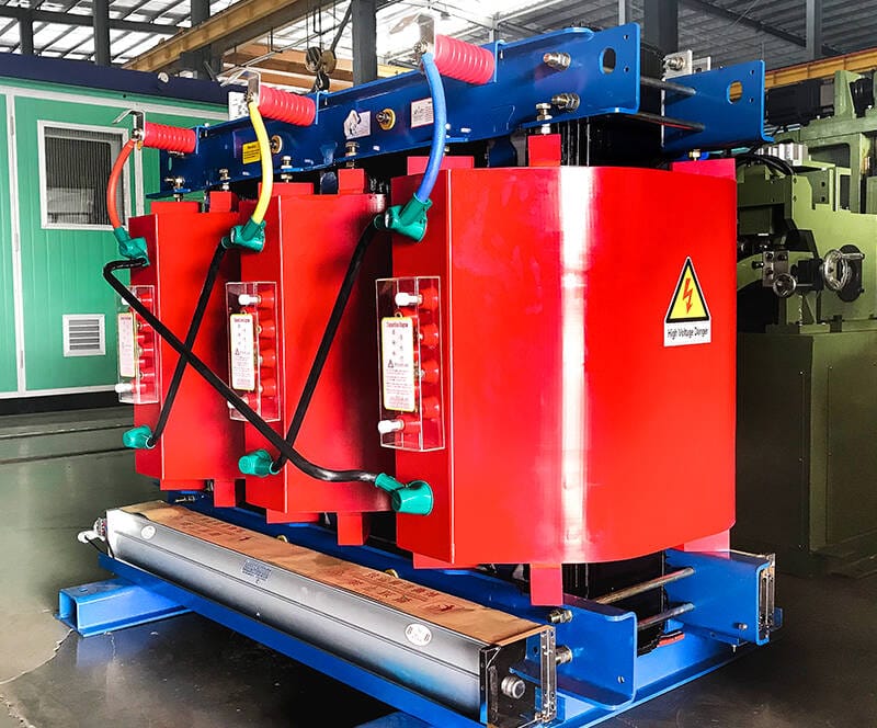 Finished SCB12 10KV cast resin dry type transformers lined up in factory workshop for inspection and delivery