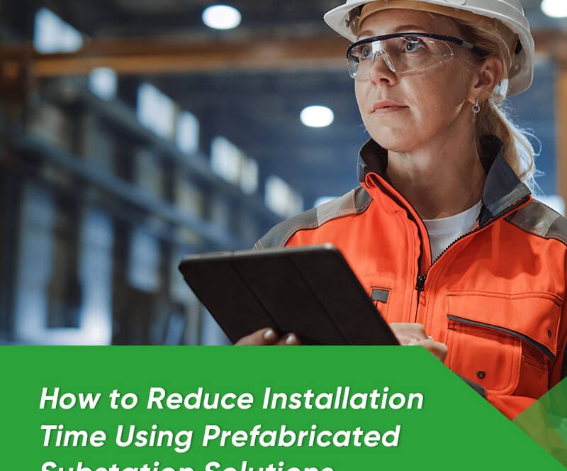 A modern prefabricated substation unit being lowered onto a concrete foundation at a large industrial site, highlighting rapid deployment.